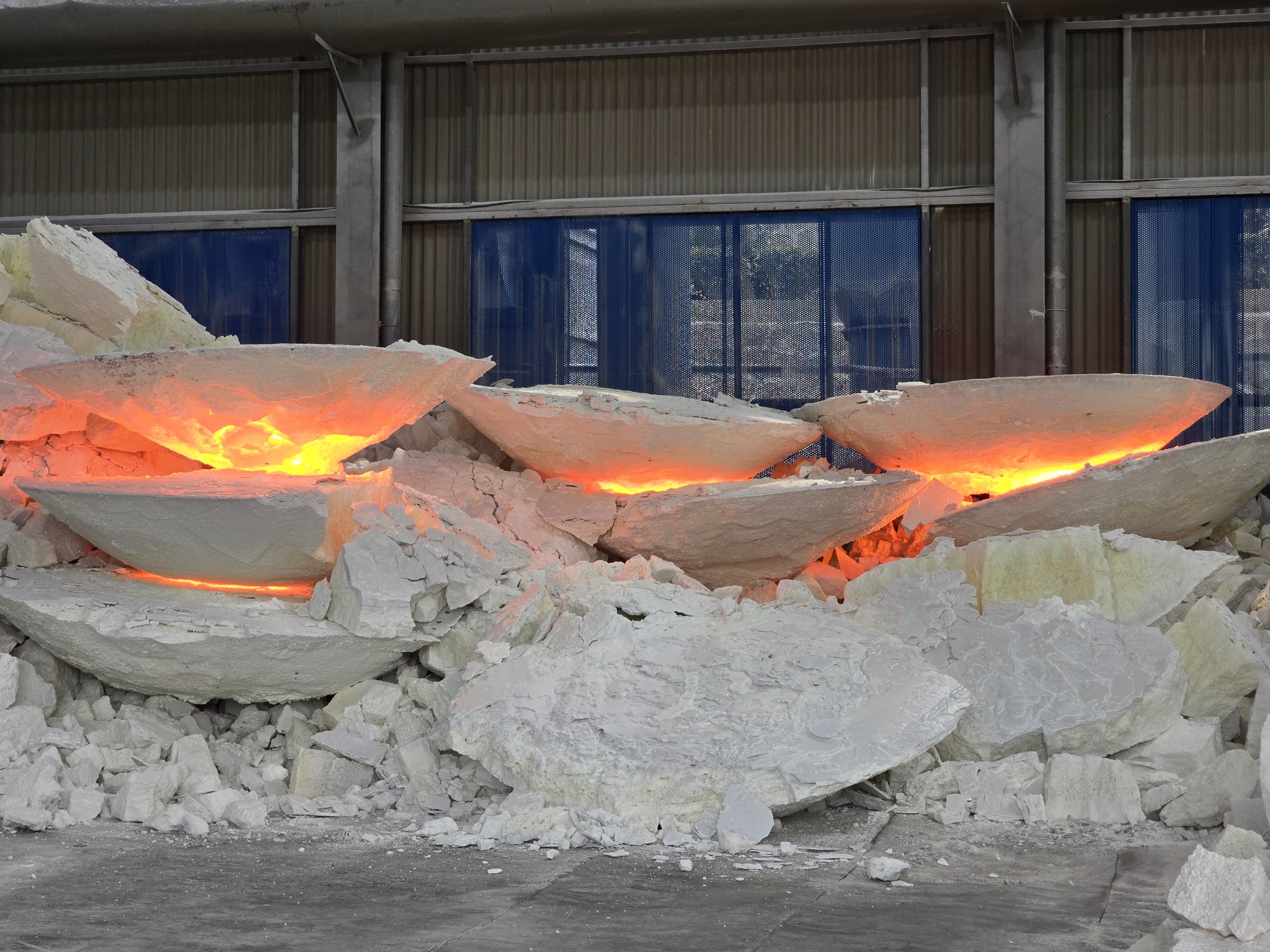 White fused alumina ingots cooling in a row at the Luoyang production base